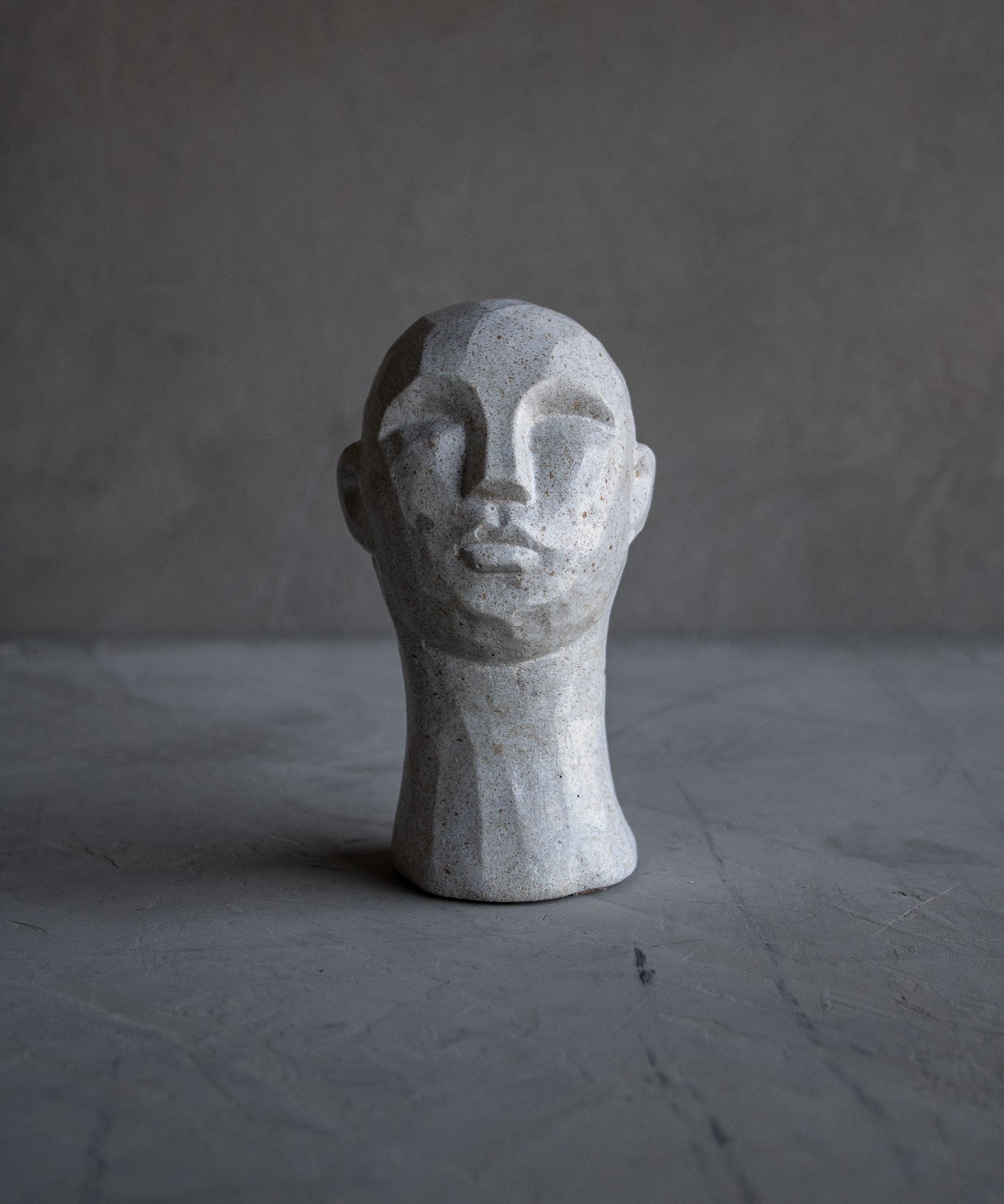 Carved Concrete Man Sculpture