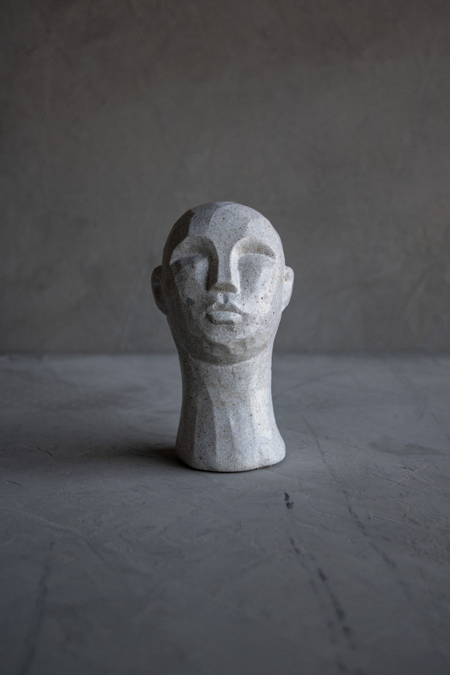 Carved Concrete Man Sculpture