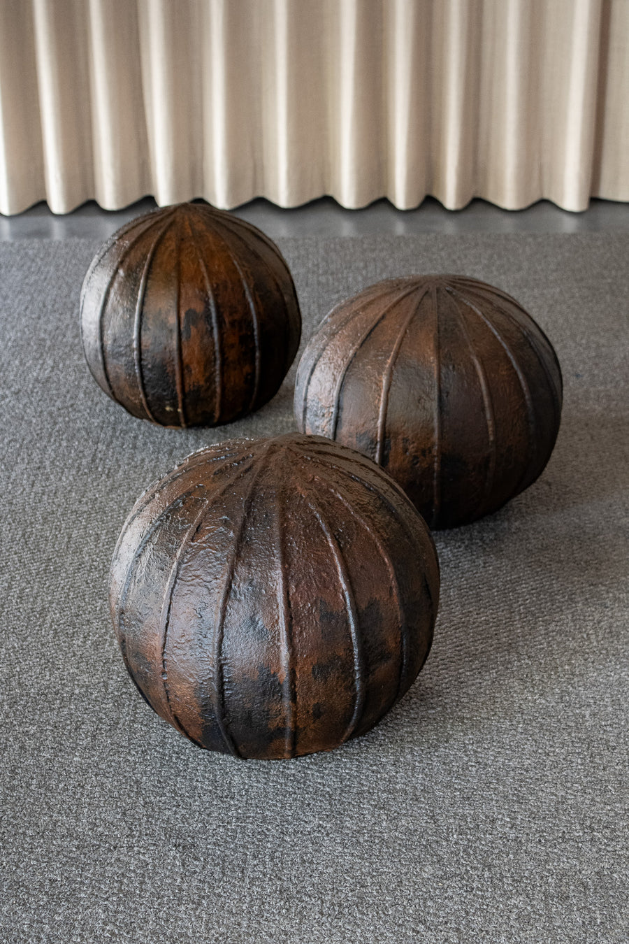 Ribbed Concrete Orb Sculpture, Brown Patina Color