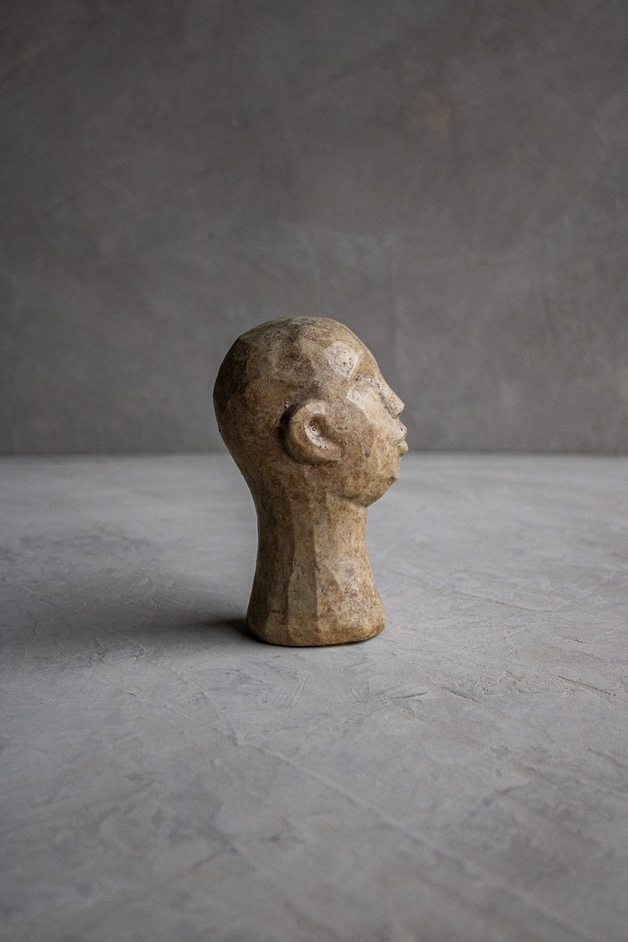 Carved Concrete Man Sculpture